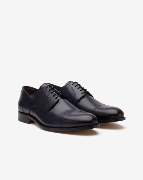 Navy blue calfskin cup-toe Derby shoes